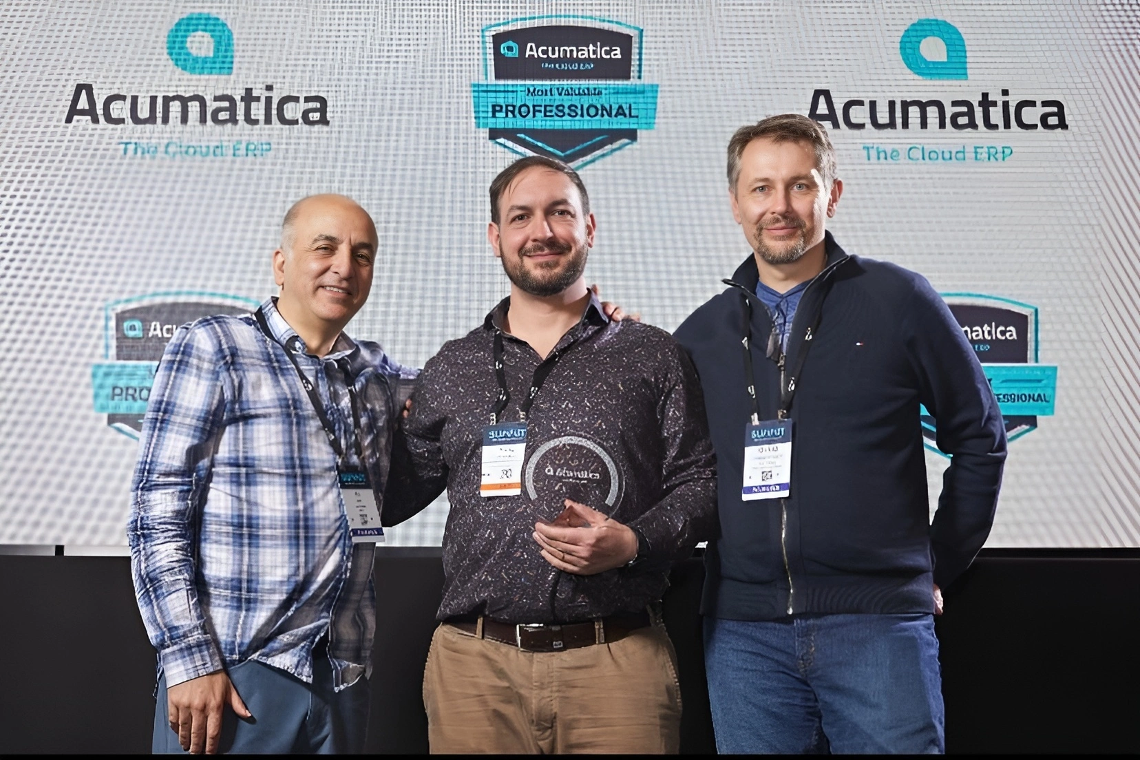 Yuriy Zaletskyy, Ali Jani, and Michael Schelkonogov. Acumatica MVP Award. Acumatica Summit 2024